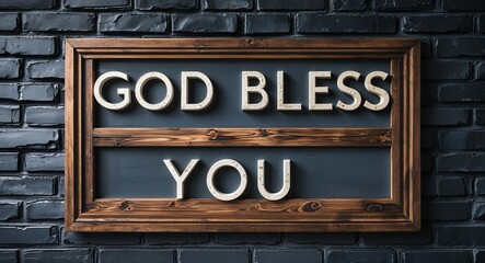 Fototapeta premium God bless you lettering on a signage in brick wall dark background