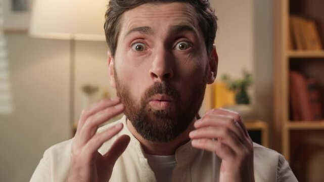 Caucasian man shocked surprised male homeowner looking at camera home positive amazed guy happy businessman looking at camera shock open mouth surprise wonder amazing good news wow emotions excited