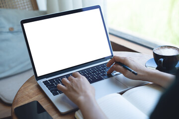 Mockup blank screen laptop computer. Business woman working on laptop computer at home office, planning work project on notebook. Student studying online via laptop, template for online marketing