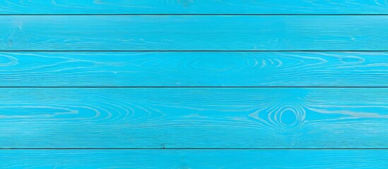 Fototapeta premium Wood blue background with a textured table and weathered surface. The light tones evoke summer, featuring aged board, wooden floor, and a rustic top view.