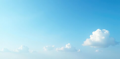 Soft blue sky with few white clouds drifting lazily, peaceful, atmosphere, serene