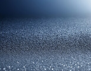 Obraz premium Abstract close-up of textured surface with shimmering beads of water in a cool blue tone.