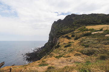 Jeju-do, Seongsan Ilchulbong  landscape, volcanic tuff cone, Sunrise peak, Jeju Island, South Korea, Seongsan-ri, Seogwipo, Jeju Province landscape view in a sunny day, with sea, cliffs hiking trail
