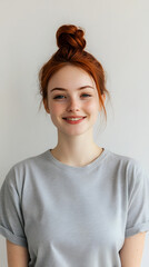 Fototapeta premium Portrait of a joyful woman with a red hair bun 
