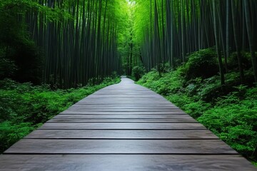 Obraz premium A serene bamboo forest with a wooden pathway leading into the misty distance