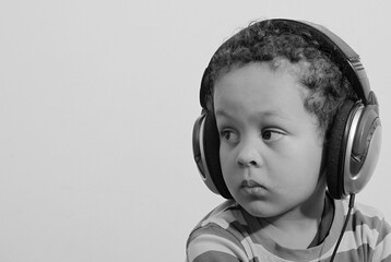little boy with headphones enjoying disco music with people stock image stock photo