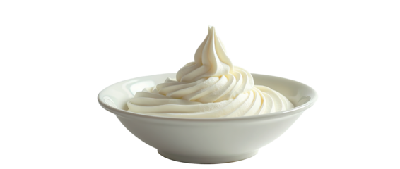A fluffy, snow-white swirl in a deep white plate. The elegant folds give it an airy look. The dark background emphasizes its rich form.