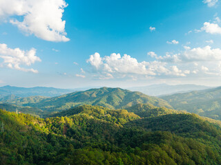 Summer Morning Mountain Landscape with Green Meadows and Blue Sky