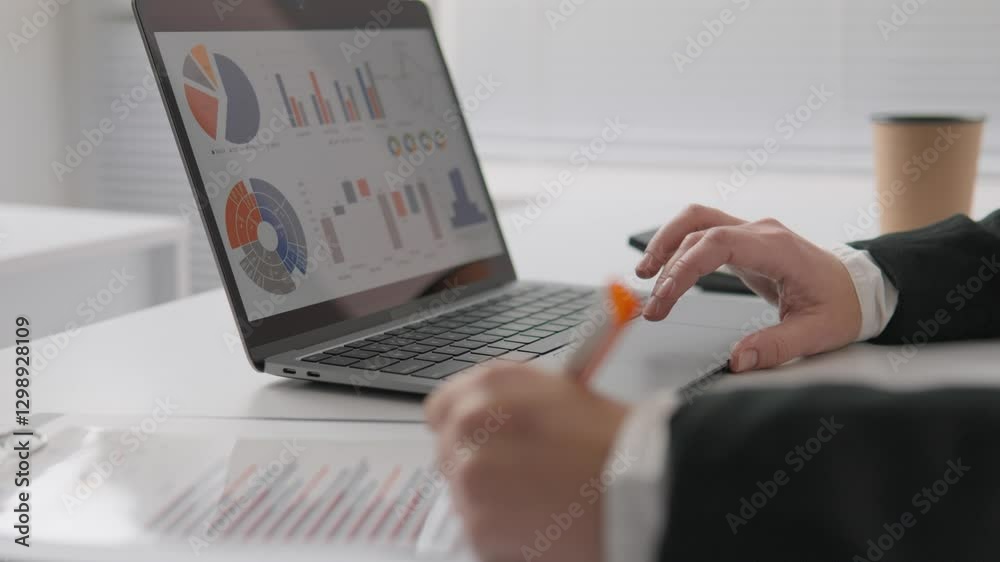 Poster analyzing data trends on a highperformance laptop in a modern office is vital for informed decisions