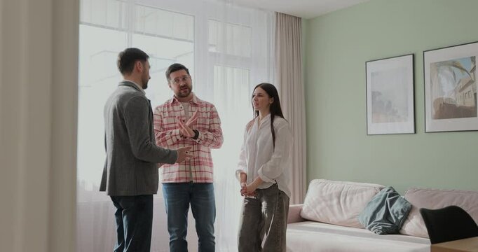 Angry couple with real estate agent visiting apartment for rent or sale. Buying home concept.