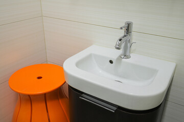 Faucet with ceramic sink in the bathroom