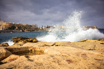 A lot of spray from the waves of the ocean Coast of the island of Malta winter