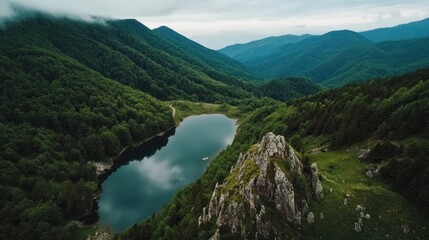 Majestic Aerial View of Serene Mountain Lake Surrounded by Forests