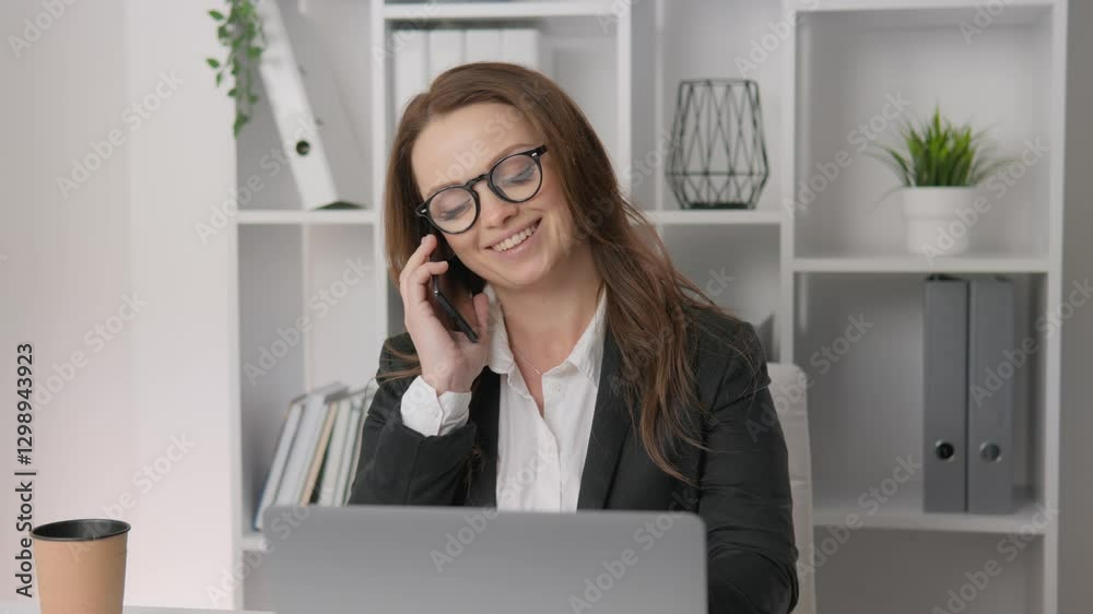 Poster a professional woman is engaged in an important phone call while working at her organized desk that 