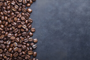 Coffee beans on a dark background with copy space, creating a minimalist and elegant composition.