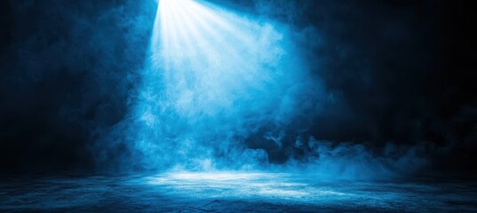 Obraz premium Ethereal Blue Light Illuminating Smoke on Dark Background Creating a Mystical Atmosphere Suitable for Creative Projects