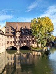 Nuremberg, Germany 10.17.2019: View of Heilig-Geist-Spital from Museumsbrücke in Nuremberg, Germany