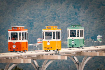 Coastal Monorail on the Sea: a scenic trip along a beach track. A blue rail train trip to Haeundae Cheongsapo, Busan, South Korea.