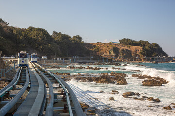 Coastal Monorail on the Sea: a scenic trip along a beach track. Monorail trains at Jukbyeon Port, Uljin County, North Gyeongsang Province, South Korea.