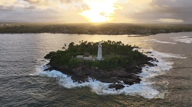 Drone footage of Dondra Head lighthouse with scenic sea view at sunset