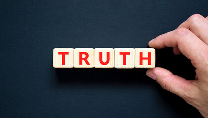 Truth symbol. Concept word Truth on beautiful wooden blocks. Beautiful black table black...