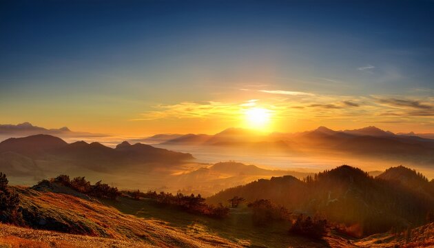 A breathtaking sunrise over a misty mountain range with golden light.