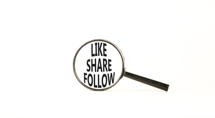 Like share follow symbol. Concept words Like Share Follow on beautiful black magnifying glass. Beautiful white background. Business like share follow concept. Copy space.