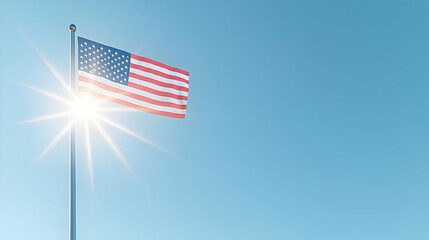 American Flag Flying on a Pole Against a Clear Blue Sky with Bright Sunlight
