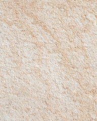 A Textured Beige Stone Wall Surface