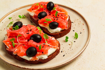 sandwiches with red fish, cream cheese, olives and microgreens, breakfast,