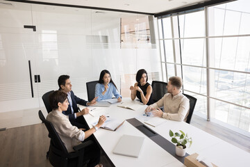 Creative brainstorming. Diverse multicultural managers executives entrepreneurs group gather around...