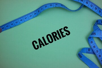 Blue Measuring Tape Representing Fitness and Calorie Consciousness on Green Background