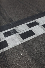 Fototapeta premium Asphalt racing track finish line side view
