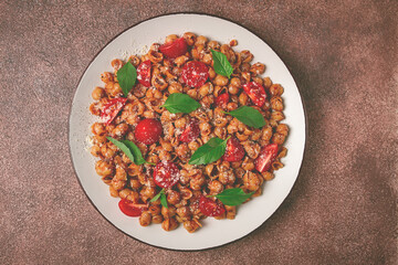 Tuscan pasta with smoked paprika and basil,parmesan cheese, Italian traditional cuisine,