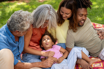 Happy multigenerational family enjoying outdoor time together