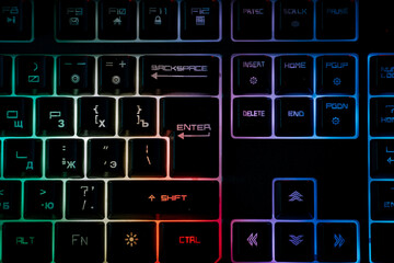 Illuminated gaming keyboard showcasing vibrant neon colors and detailed design for an immersive...