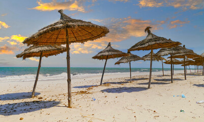 Scenic Mediterranean Beach with Straw Umbrellas