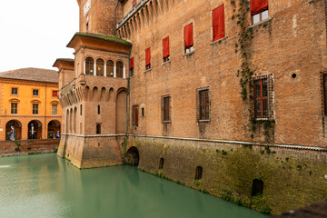 Ferrara, Ferrara,Italy March 29 2024 historic center, fortifications and castle surrounded by a moat. Squares and buildings in medieval style.Beautiful, unique Italian cities. World cultural heritage.