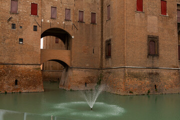 Ferrara, Ferrara,Italy March 29 2024 historic center, fortifications and castle surrounded by a moat. Squares and buildings in medieval style.Beautiful, unique Italian cities. World cultural heritage.