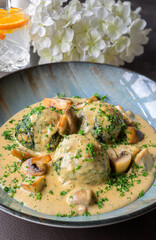 spinach dumplings in creamy mushroom sauce