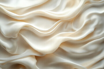 Fototapeta premium Creamy, luxurious silk fabric with soft, flowing folds and elegant drapes.