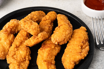 Chicken tenders. Fried chicken breast strips	
