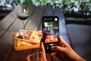 mobile phone shooting food and wine