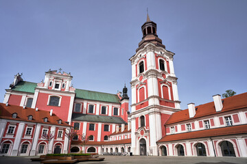 Obraz premium courtyard with baroque buildings and a bell tower of a former monastery in the city of Poznan