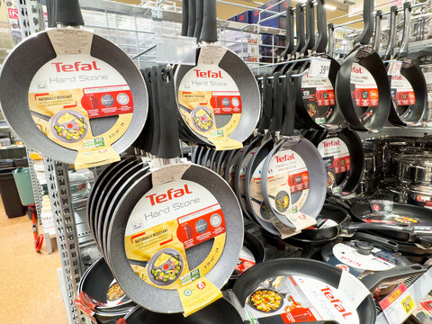 Display of tefal non-stick frying pans in store