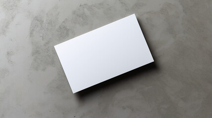 Blank white card on a flat surface, symbolizing simplicity and clarity in design.