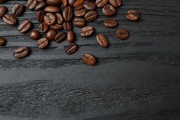 Fresh coffee beans on wooden background