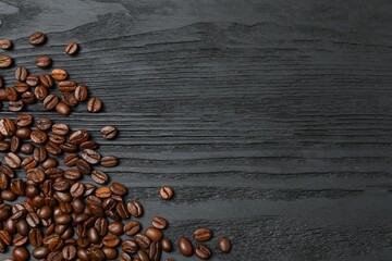 Fresh coffee beans on wooden background
