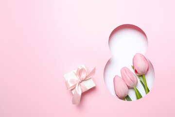 8 March greeting card design with tulip flowers and gift box, top view. Happy International Women's Day