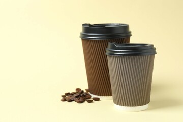 Paper cups with plastic lid on light background. Coffee to go